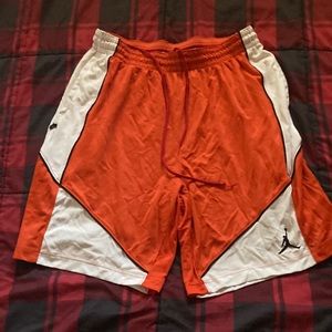 Orange white and black mens XXL Jordan basketball shorts.